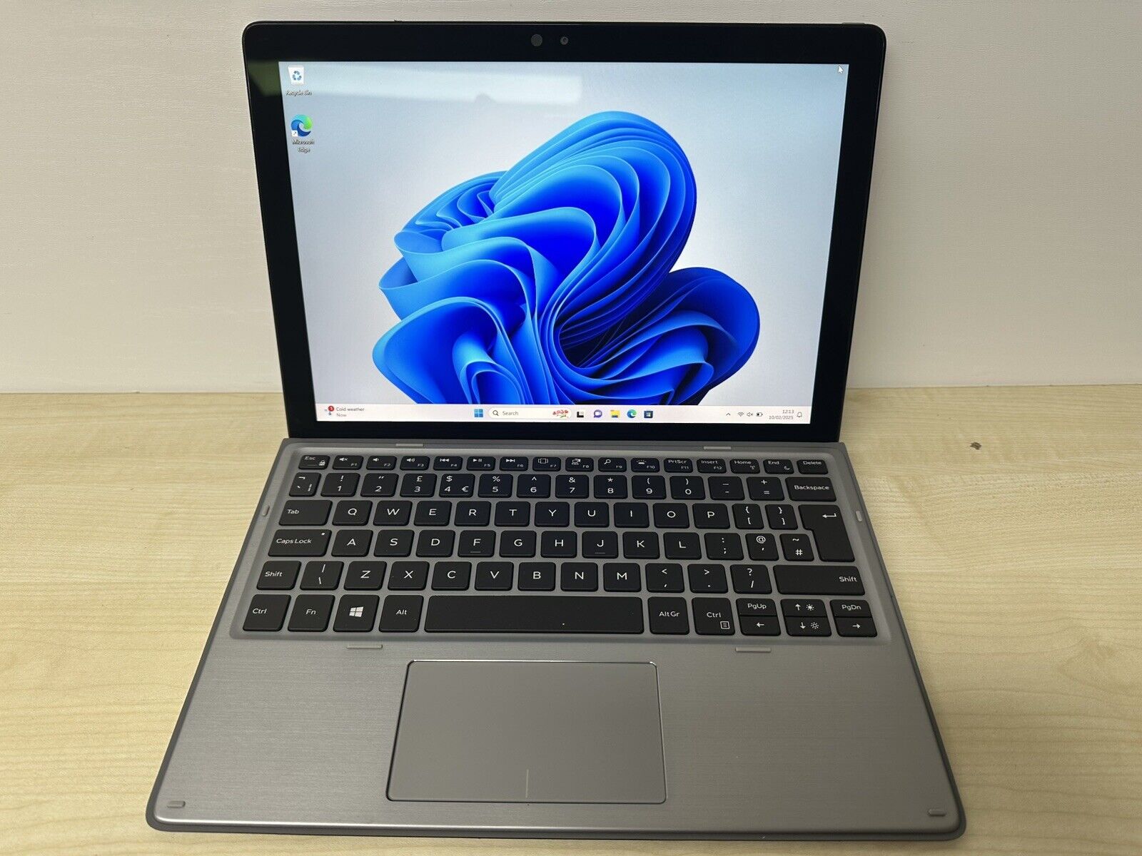 Dell Latitude 7210 2-in-1 laptop, shown with the screen detached from the keyboard, highlighting its tablet form.